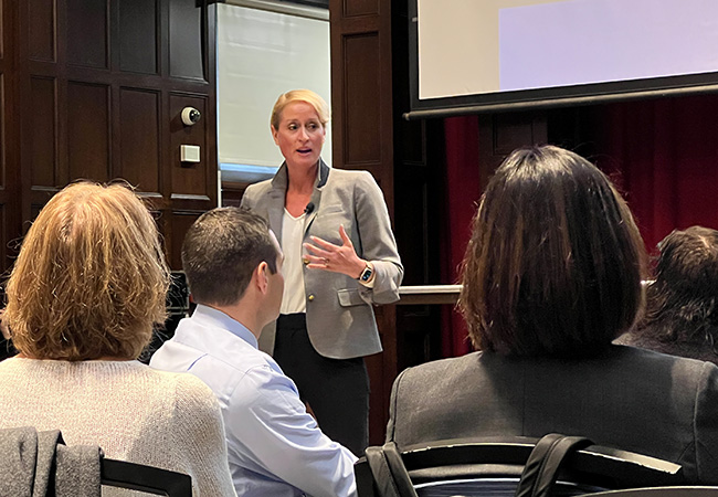 Kandi Wiens speaking in front of an audience of superintendents at a Penn GSE School Study Councils meeting on burnout conducted December 7, 2022.