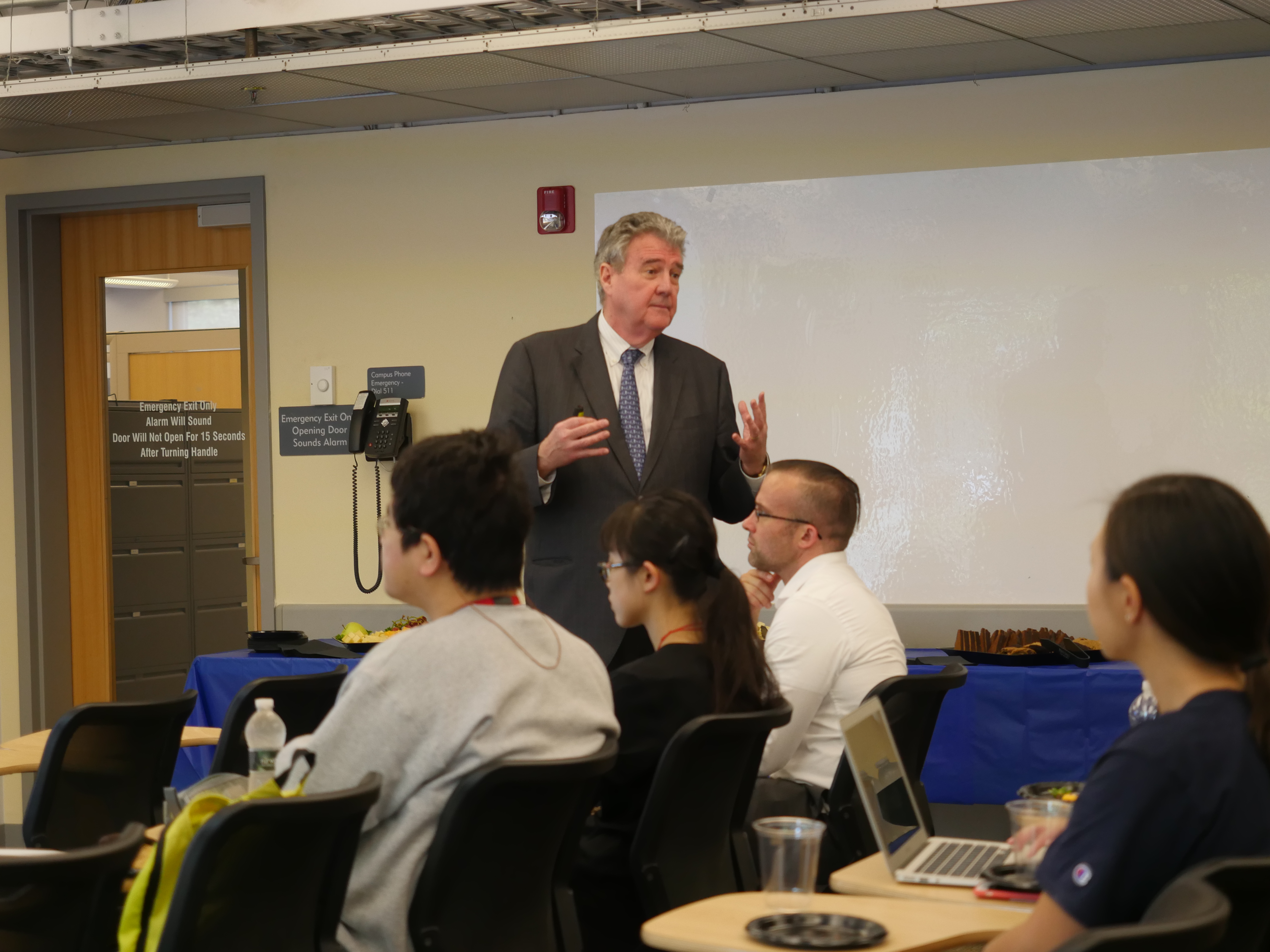 Alan Ruby convenes the first talk in Penn GSE's Global Engagement Speaker Series. He speaks to the audience in a classroom.