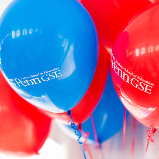 Red and blue balloons sporting the Penn GSE logo