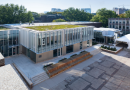 A view of the 2023 courtyard and lobby additions to the Penn GSE building from above, showing their green roofs and rear facade