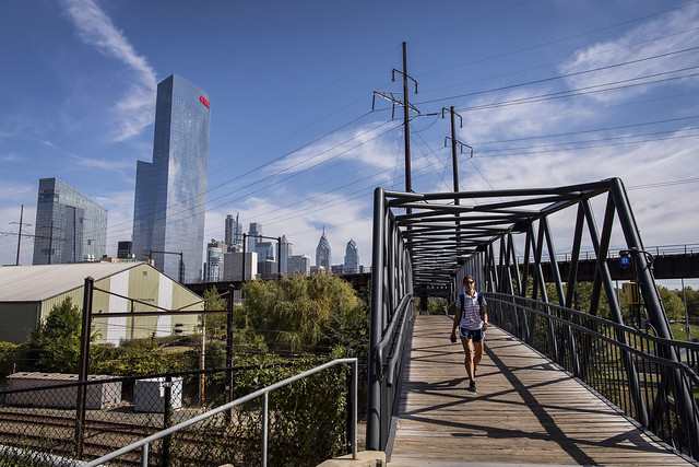 Student crosses bridge at Penn.