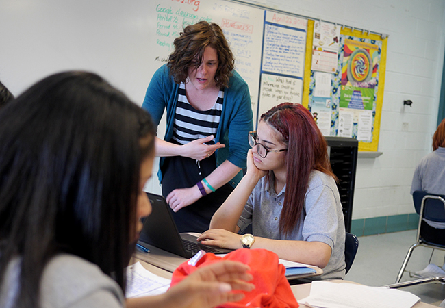 Students doing work in classroom.