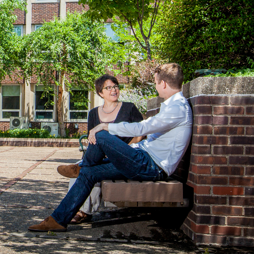 People in Penn GSE courtyard on sunny day