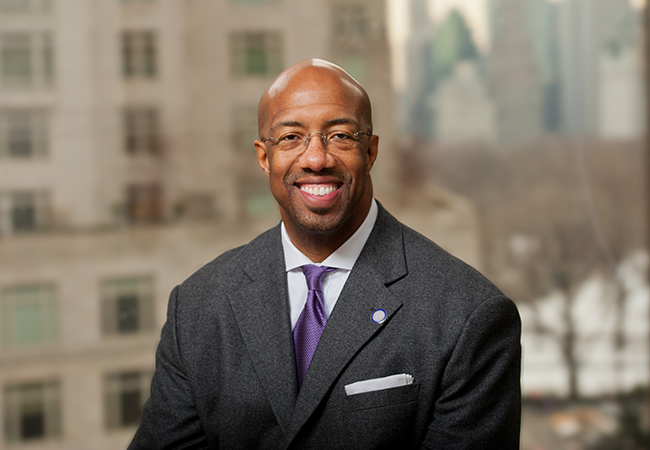 </span>Man with glasses and purple tie.