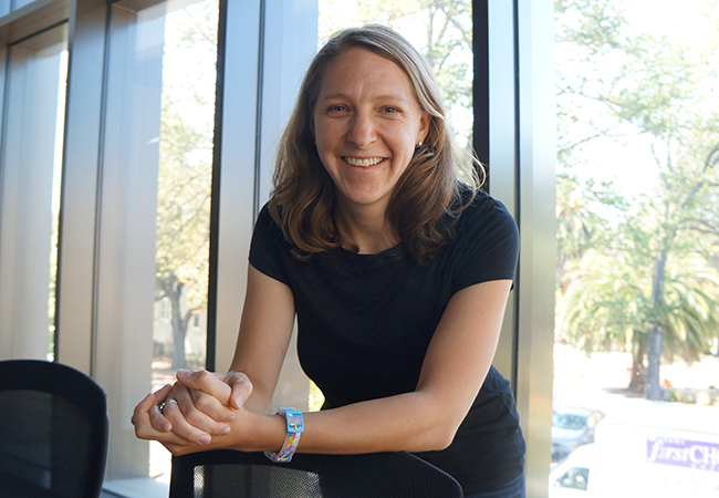 Rachel Baker smiling in front of a window