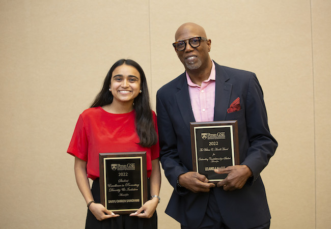 Saryu Sanghani and Leland McGee holding their awards