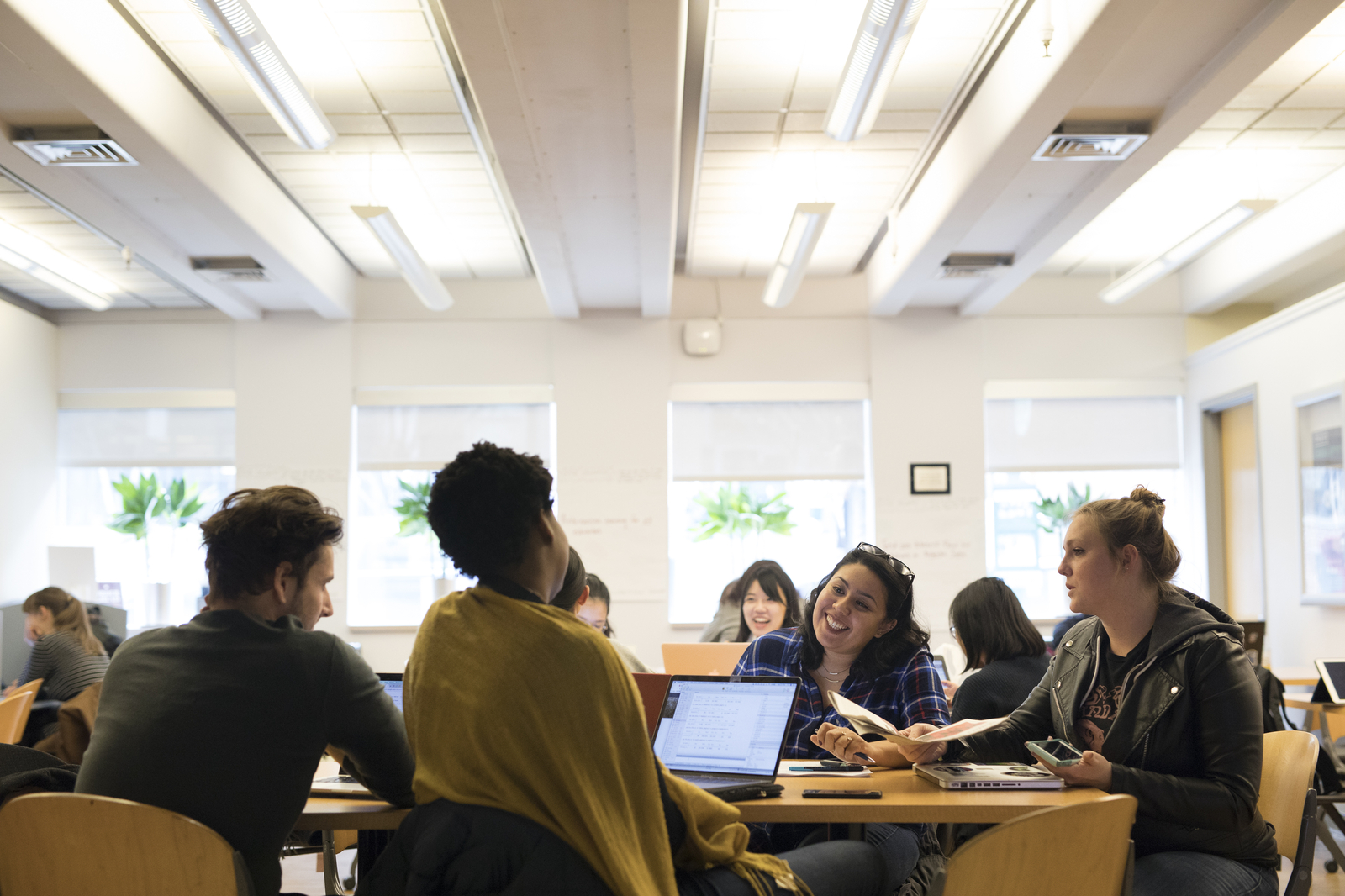 Students sitting at table.