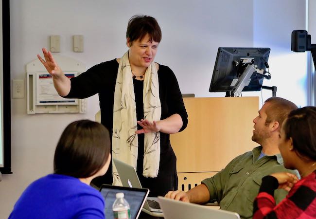 Yasmin Kafai presenting at the front of a classroom