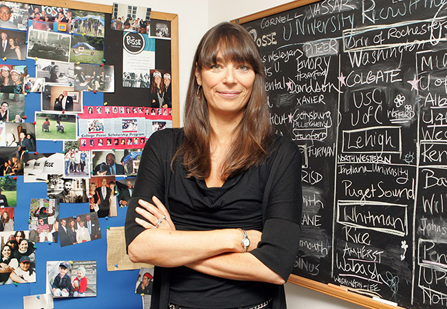 Deborah Bial standing in front of two chalkboards.
