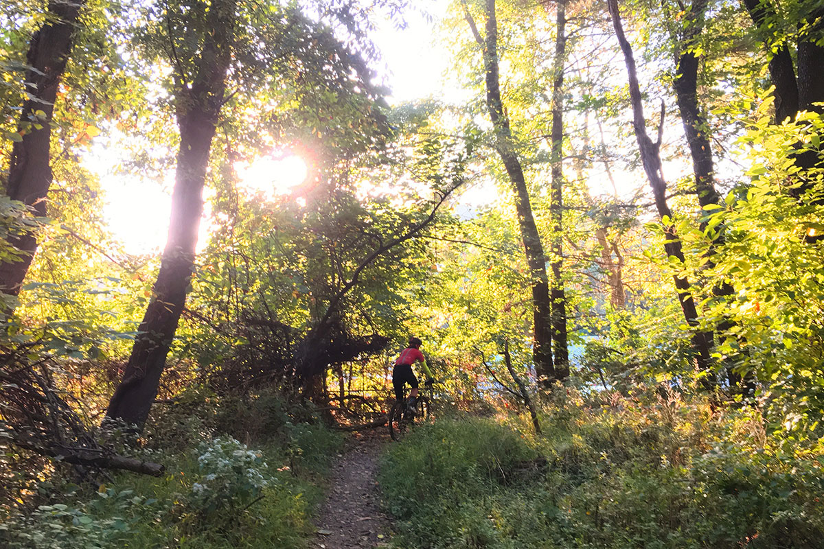 biker crushing a trail as the sun goes down in beautiful fairmount park