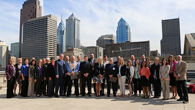 Group shot in front of the Philadelphia skyline