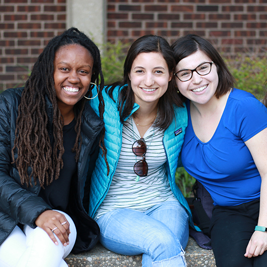 Three students in the courtyard