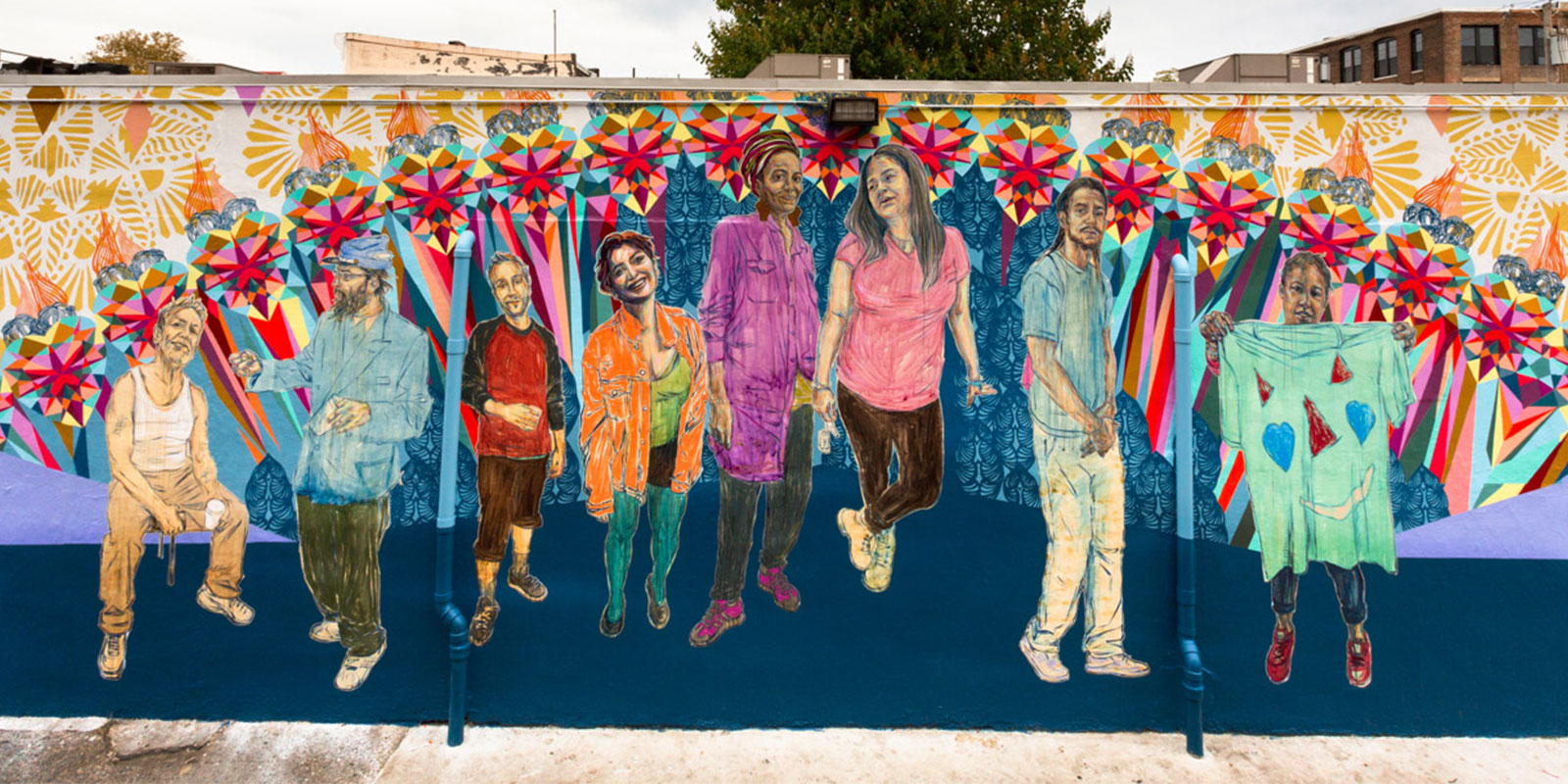 Colorful mural of people holding hands