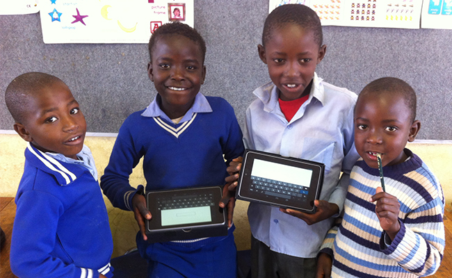 Young people showing their electronic devices.
