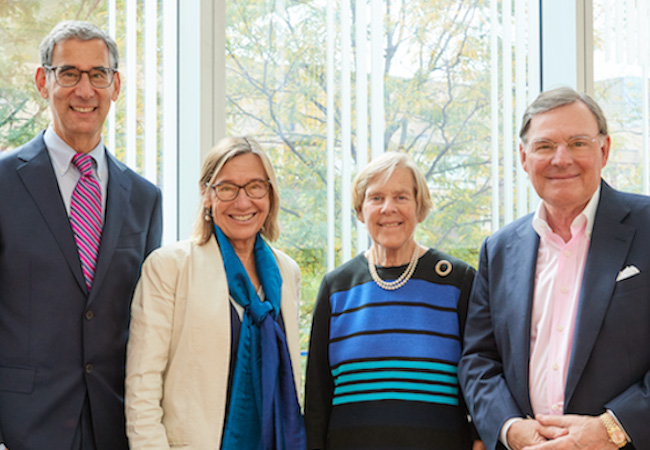 Michael Golden, Pam Grossman, Suzanne McGraw, and Harold McGraw III posing for photo