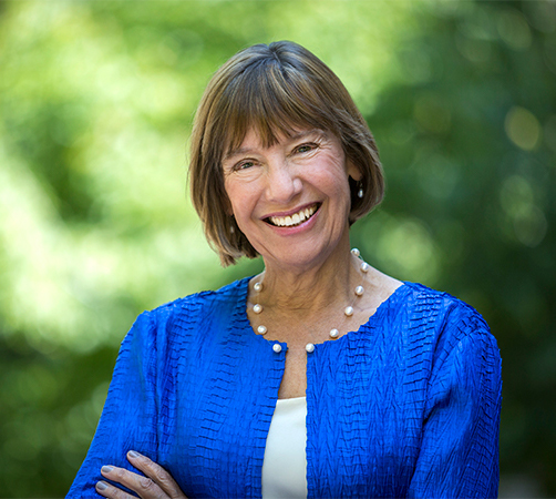 Headshot of Dean Pam Grossman in a blue jacket and white blouse on Locust Walk