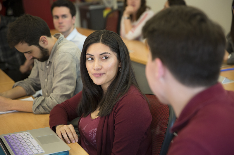 A student listens to a point during class discussion.