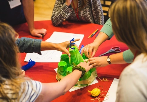 Kids doing a cup activity together