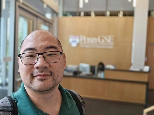 Seiji Isotani selfie in the Penn GSE lobby