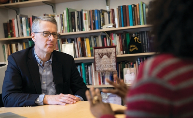 Mid-Career program director Michael Johanek meets with a student in his office