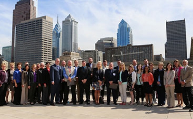 Group shot in front of the Philadelphia skyline