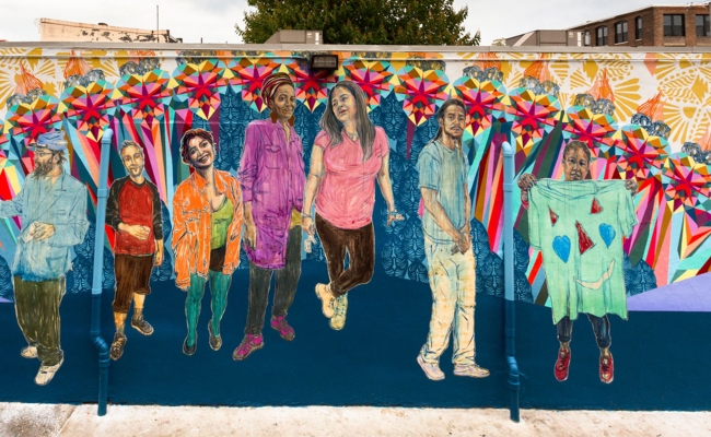 Colorful mural of people holding hands