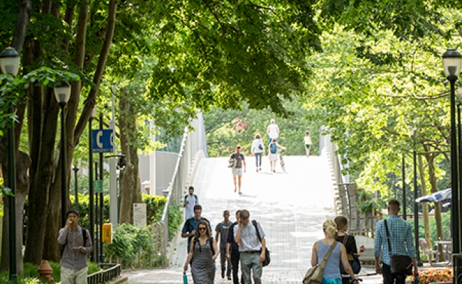 Penn students walking on Locust Walk in the summer