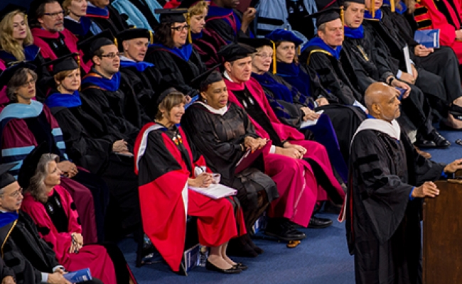 Penn GSE faculty seated onstage at Commencement