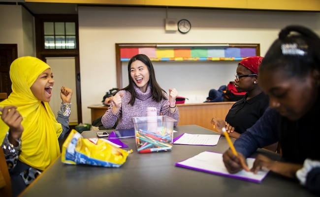 Shiyu Sun (center) is one of the 32 mentors in the Graduate School of Education’s Possibility Mentoring Program. Sun is now in her fourth semester working with groups of middle schoolers, like Ciani Patton-Collins (left), at the General George G. Meade School in Philadelphia. (Eric Sucar, Penn Communications)