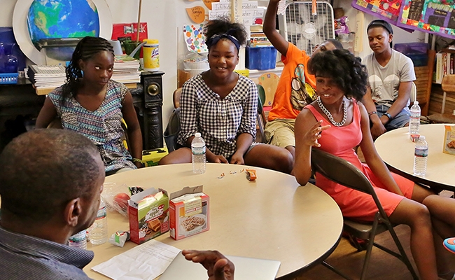 Howard Stevenson working with young people in a classroom.