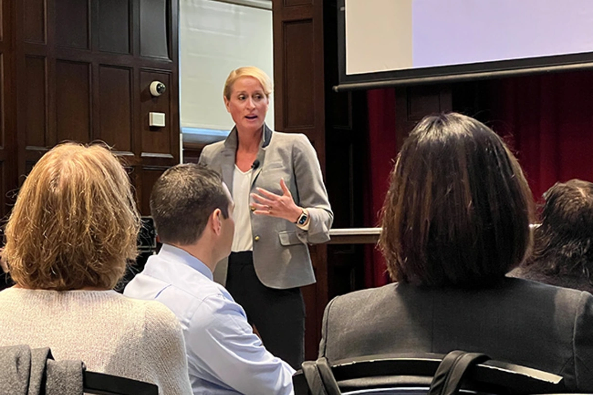 Kandi Wiens speaking in front of an audience of superintendents at a Penn GSE School Study Councils meeting on burnout conducted December 7, 2022.