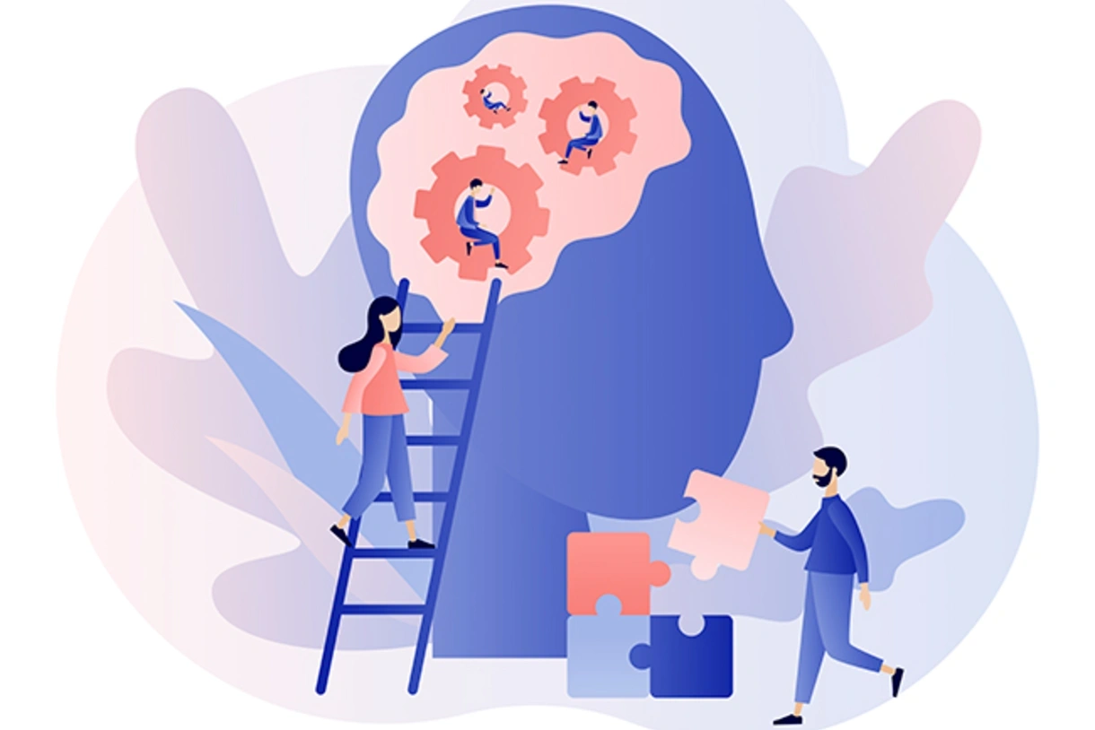 An illustration shows the shape of a human head with mechanical structures in the brain. One character climbs up a ladder and another character is picks up a piece of a puzzle.