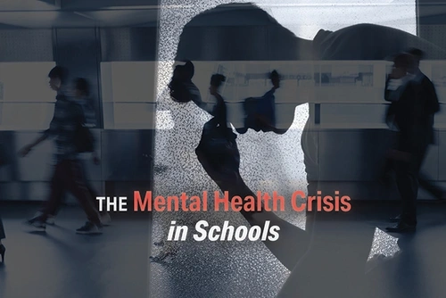 abstract graphic of a person holding their head with the overlay text "The Mental Health Crisis in Schools" .