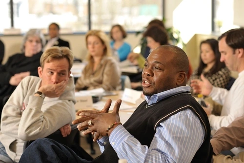 Educator speaking while others are listening