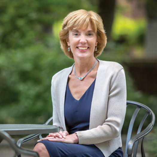 Laura Perna seated at a table outside