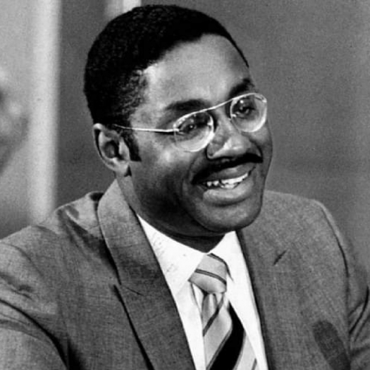Black-and-white historical photo from the 1960s of Marcus Foster wearing a suit and tie and glasses. Black-and-white historical photo from the 1960s of Marcus Foster wearing a suit and tie and glasses. 