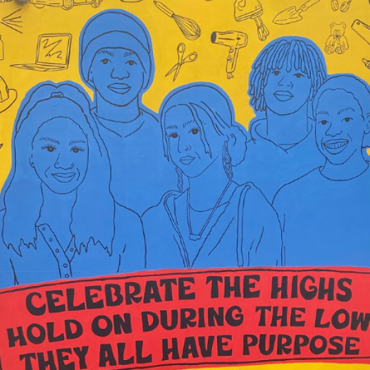 Photograph of mural depicting a group of students above the following quote: "Celebrate the highs. Hold on during the lows. They all have purpose."