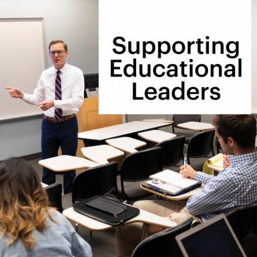 A professor wearing a white shirt and striped tie addresses a classroom of students who are listening and taking notes. The screen in the background has a large pi symbol] [Photo caption] Dr. Zachary Hermann is executive director of Penn GSE’s Center for Professional Learning, which offers virtual programs to support educators at various levels in the face of changing educational environments.