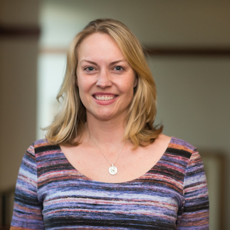 Woman with light hair smiling. 