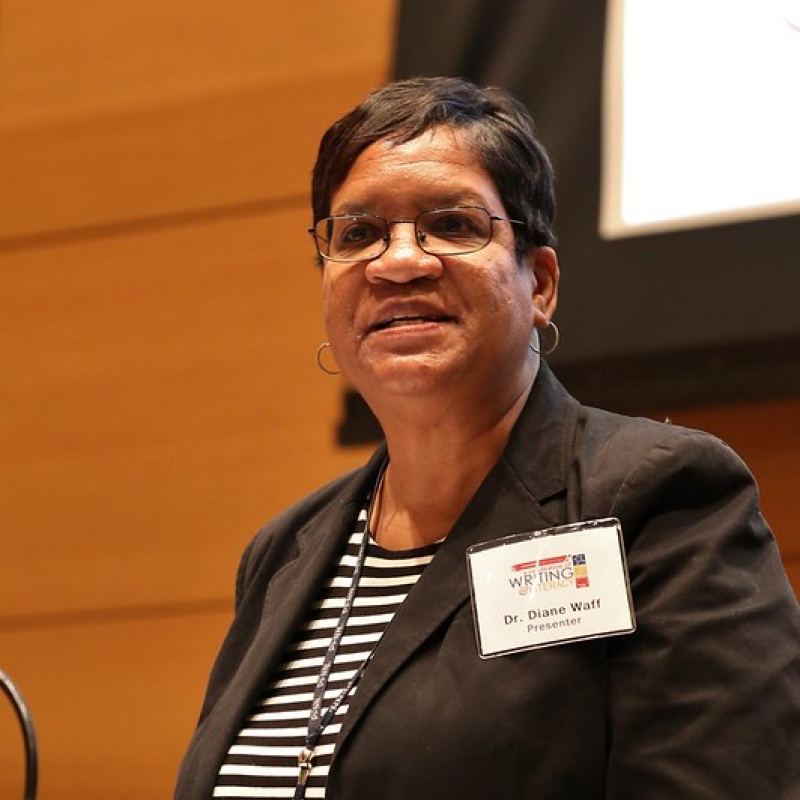 Diane Waff speaking at a podium