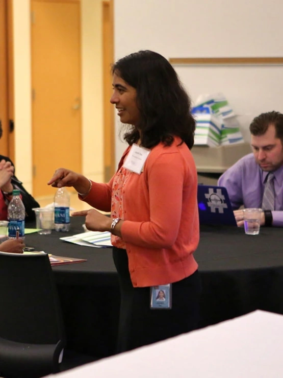 A speaker presenting to a group of educators