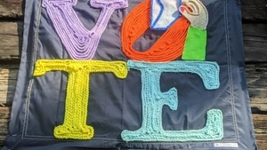 A sign encouraging people to vote. 