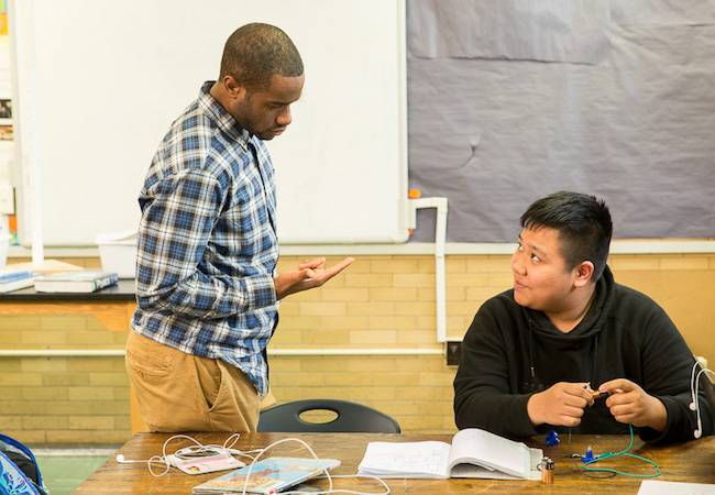 A teacher and a student work on a problem. 