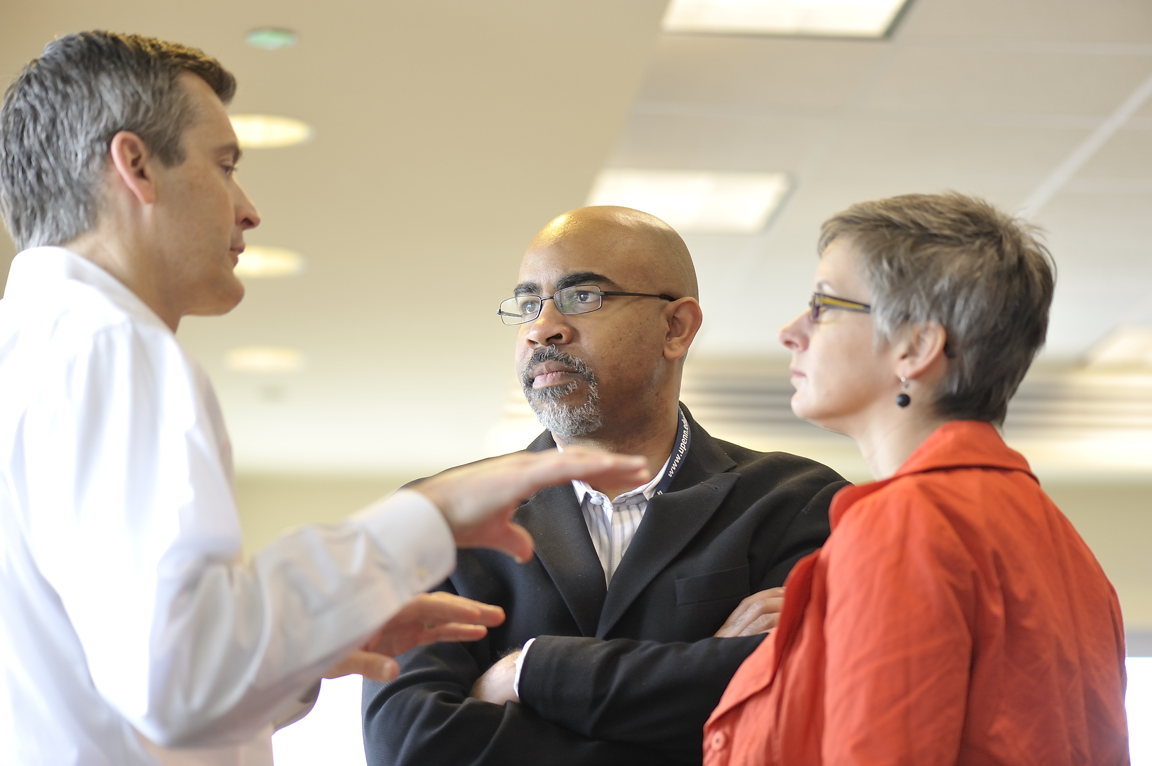 Three people talking