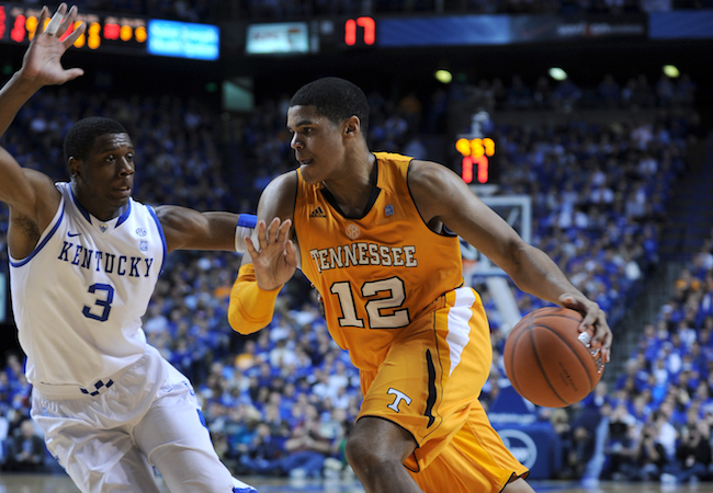 Tobias Harris, left, dribbles a basketball in a 2011 game against the University of Kentucky. 