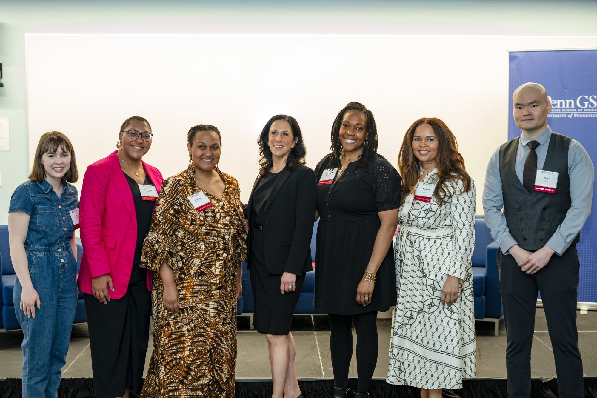 Six award-winners and the dean stand in a row and pose, smiling after the 2024 Celebration of Educators awards ceremony.