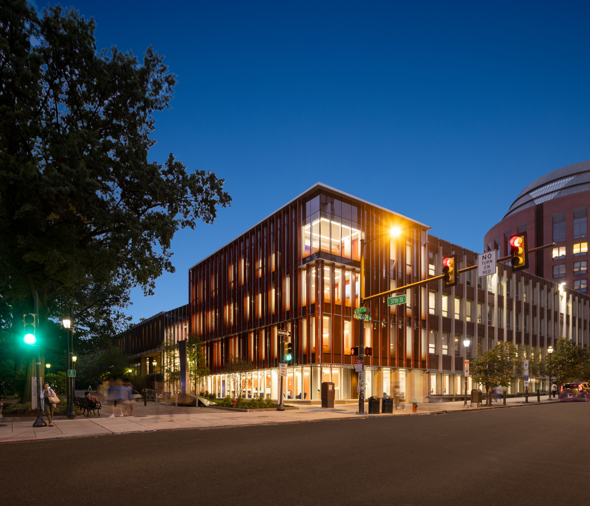Penn GSE's new building lit up at night from the corner of 37th and Walnut streets