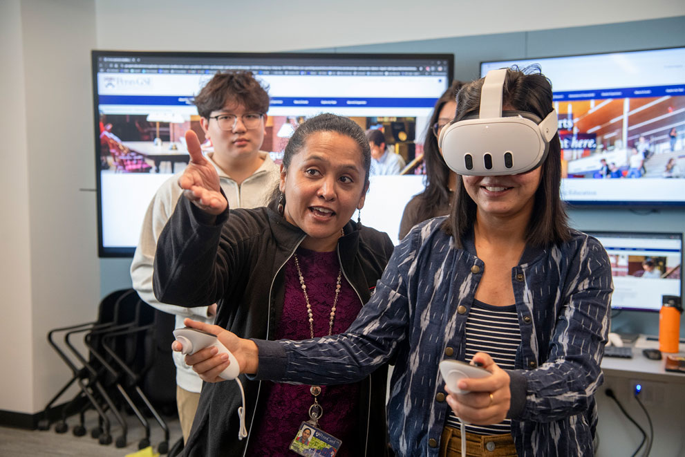 Student wearing VR headset in the AR/VR lab