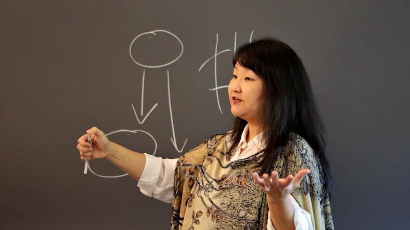 Susan Yoon teaching in a classroom