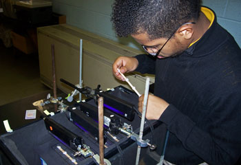 John Arnault works on his science project